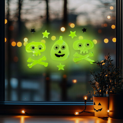 56543C • Halloweenska fosforeskujúca dekorácia na okno  - lebka - 29 x 16 cm 